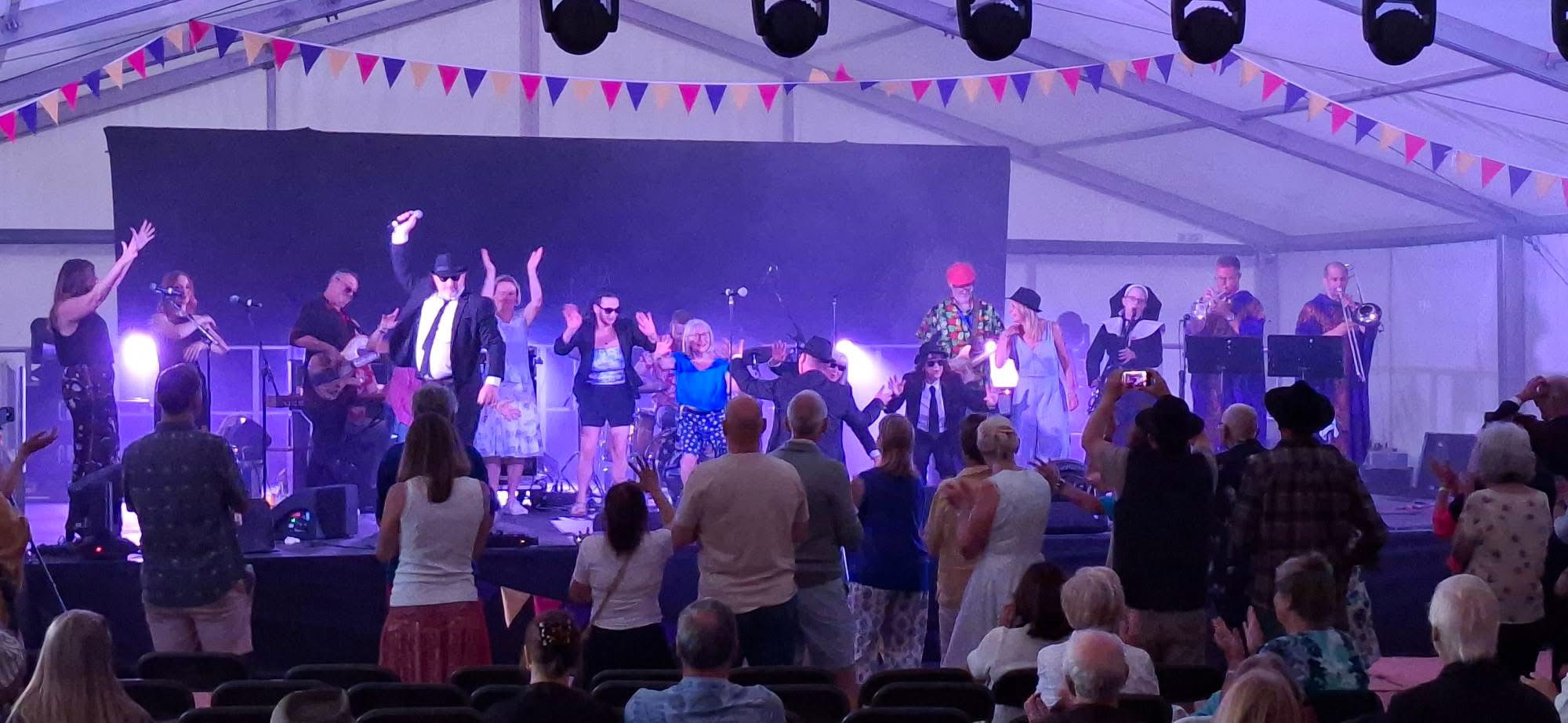 Audience dancing with The All New Blues and Soul Revue during a live festival show