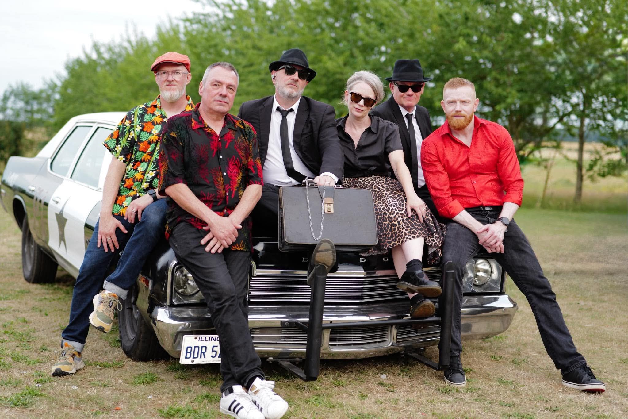 Current six-piece All New Blues and Soul Revue lineup with the Bluesmobile