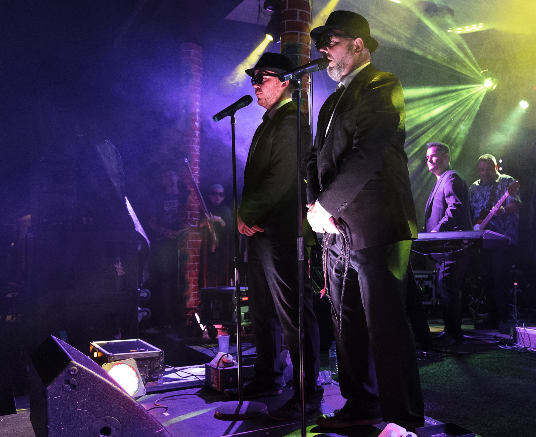 The two lead performers singing live on stage at Buckfest