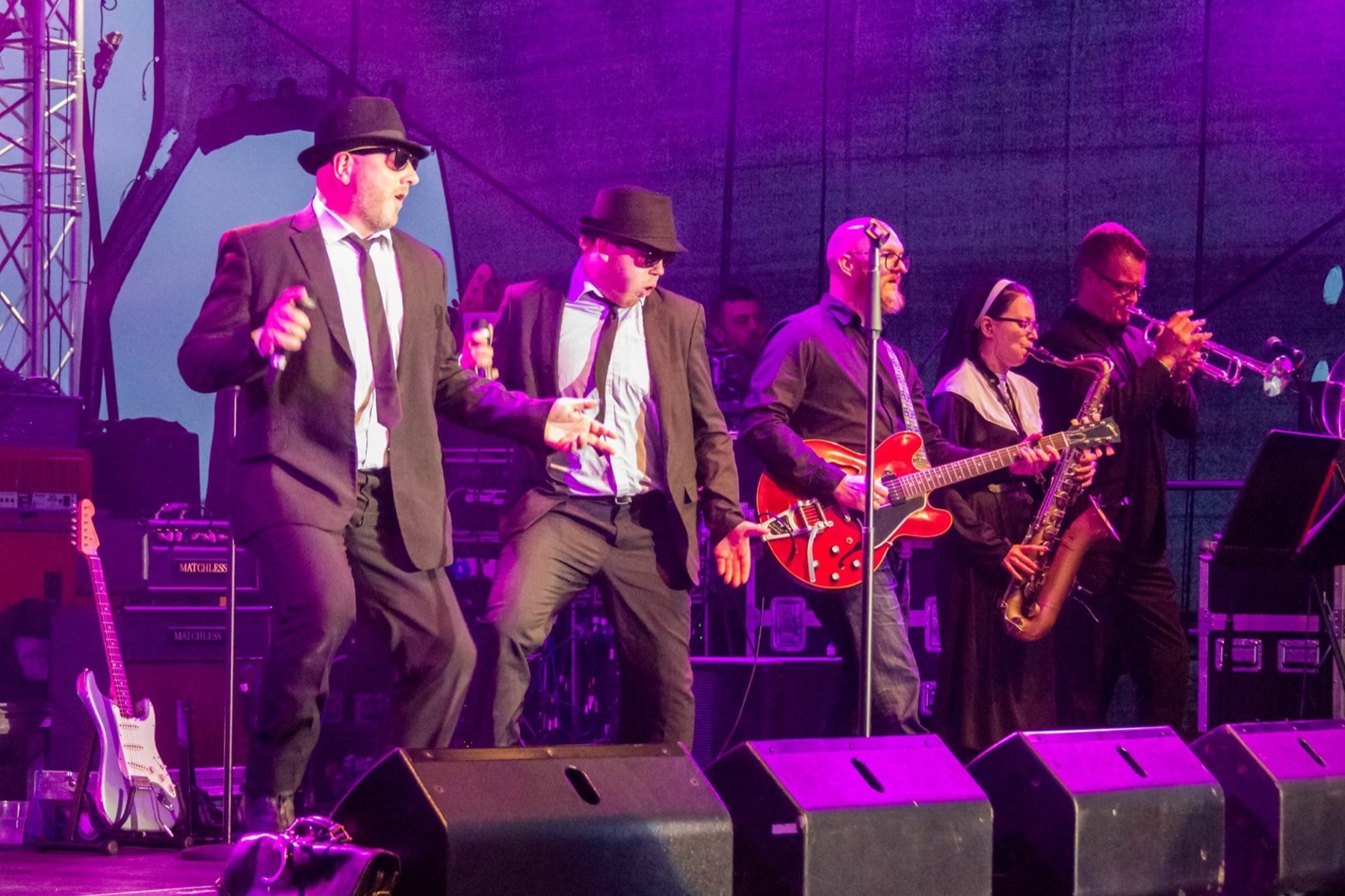 The live band, singers and brass section performing at BugJam