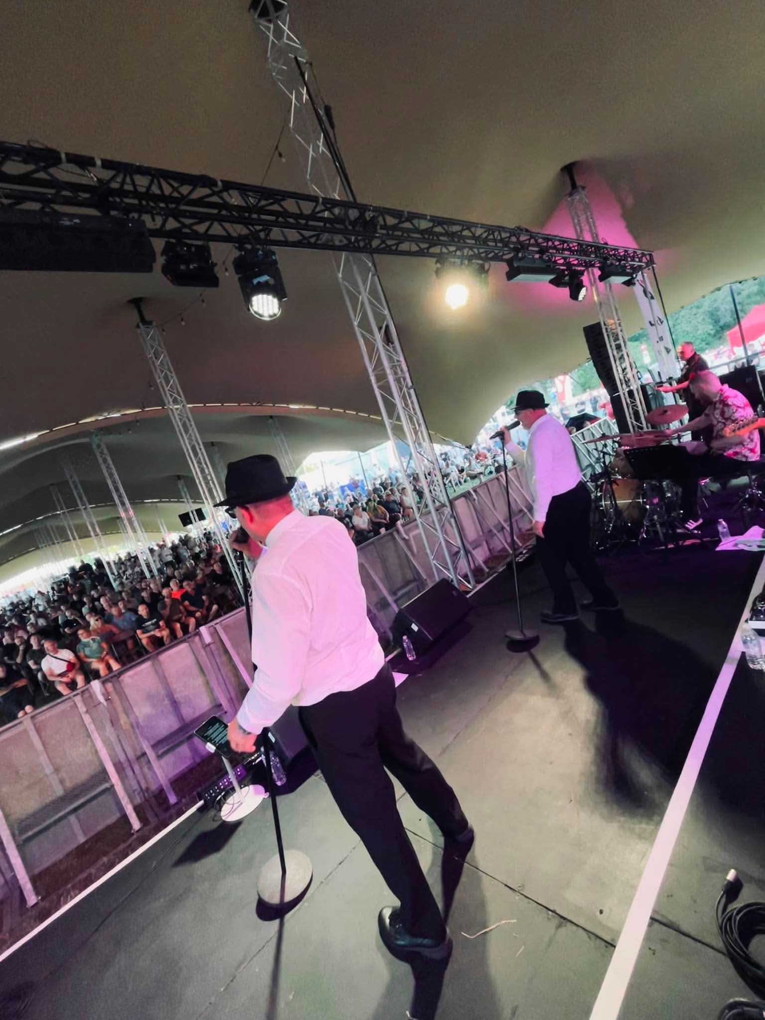 View from the stage as the band performs to a festival crowd